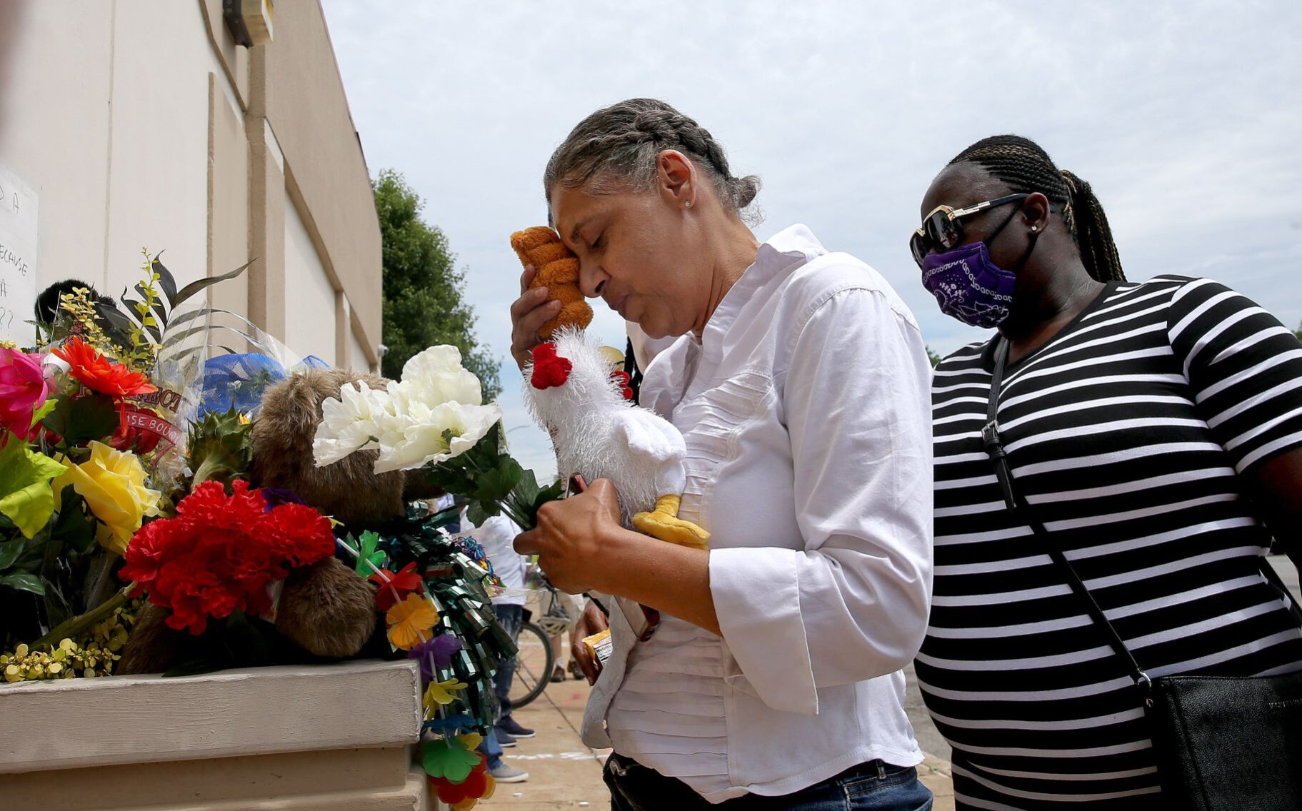 Loved ones remember David Dorn outside Lee's Pawn